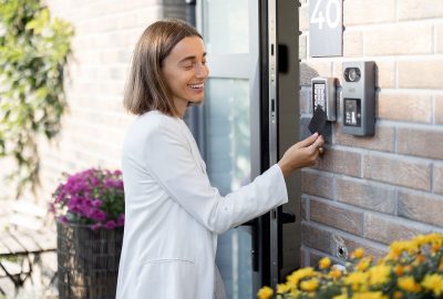 woman-gets-access-to-enter-home-by-card-6WYL2KY.jpg